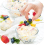 hand puts berries on ice cream